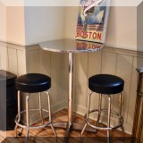 F27. Round metal hightop table with two stools. 